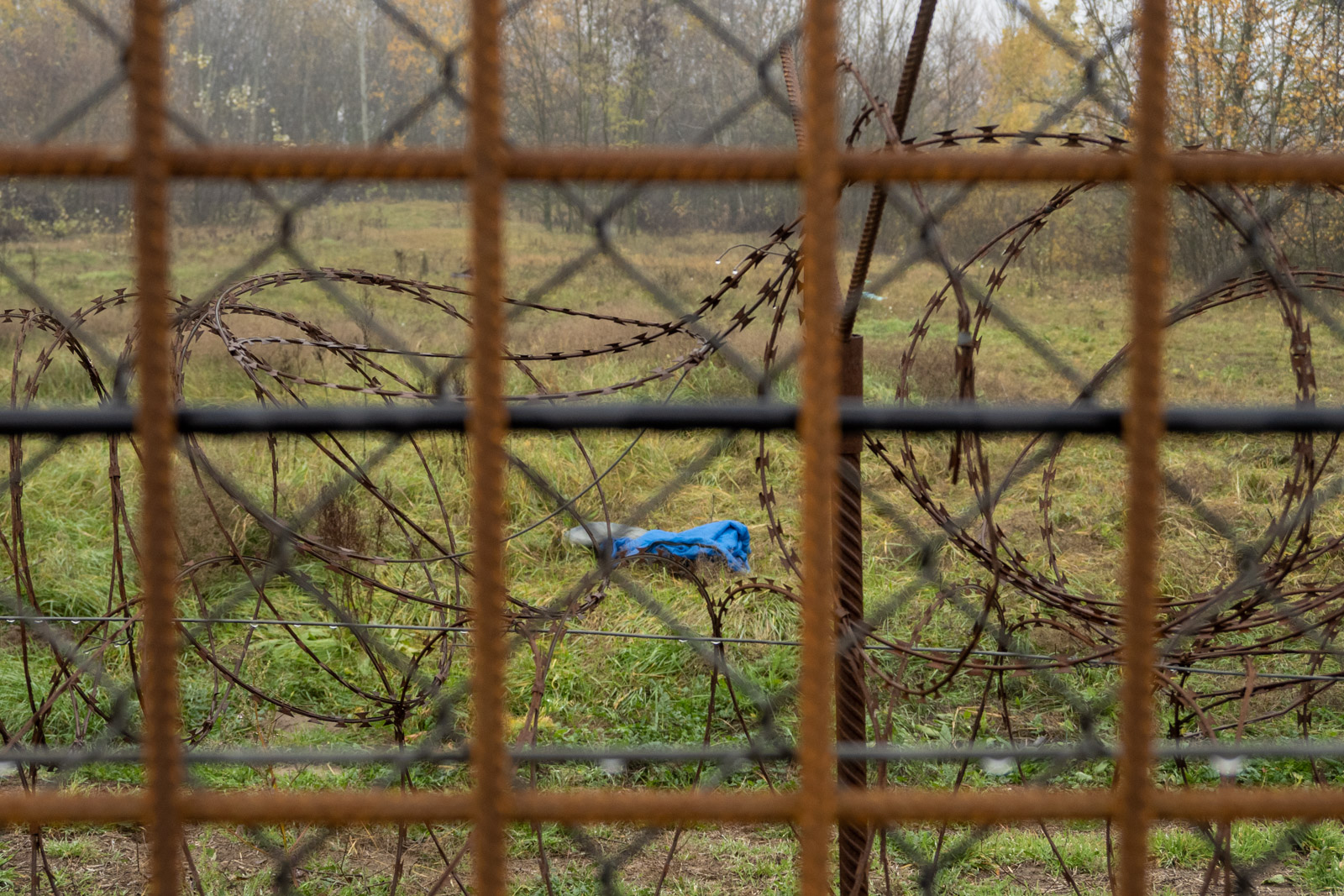 Clothes abandoned on the Serbian side seen through the main fence