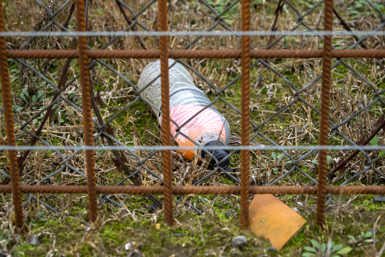 A water bottle dropped by someone trying to cross the border fences